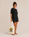 Model carrying the Duriancito cotton tote bag by Mojo Circus