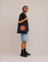 Model carrying the Same Same 2.0 cotton tote bag by Mojo Circus