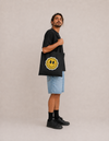 Model carrying the Same Same cotton tote bag by Mojo Circus