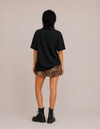 Model wearing the Same Same tee by Mojo Circus, back view